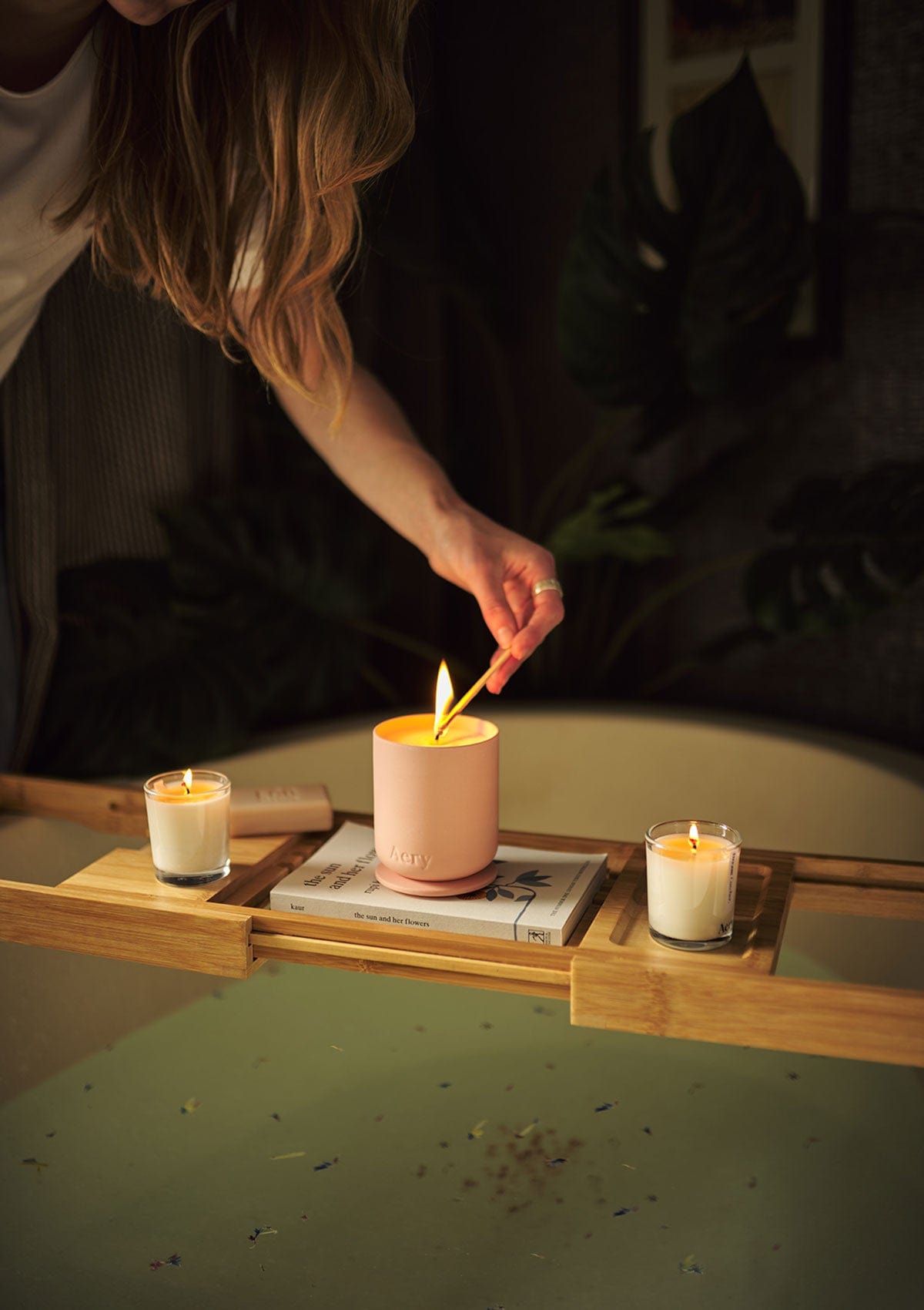 Aery Aztec Tuberose Candle being lit for a bath