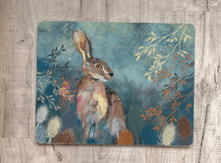 Placemat with a rabbit illustration on a wooden surface