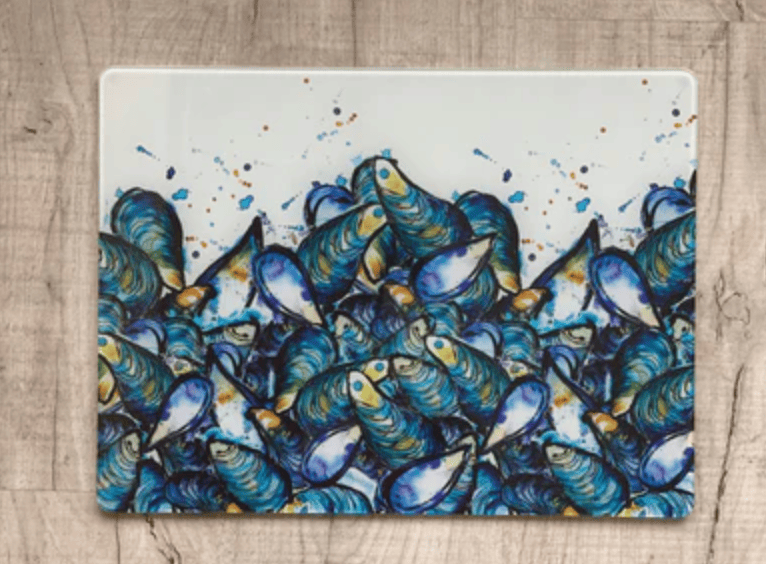 Placemat with blue mussel design on a wooden surface