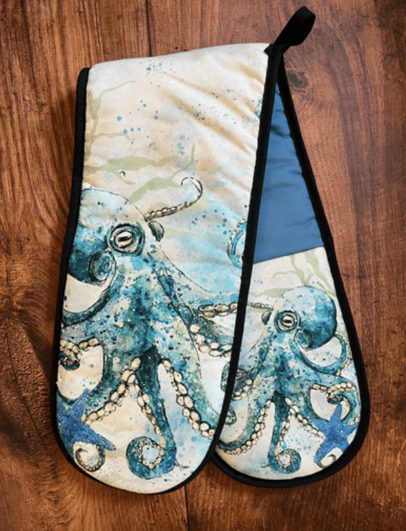 Oven mitt with octopus design on a wooden surface