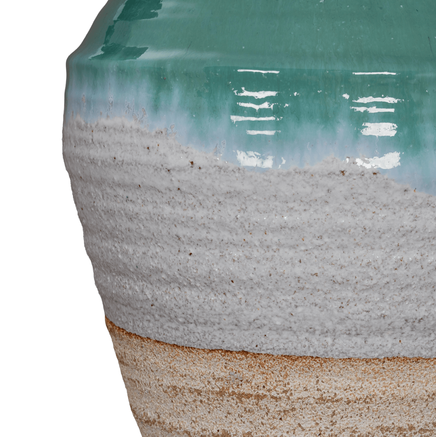 Close-up of a ceramic vase with a textured base and greenish top on a white background