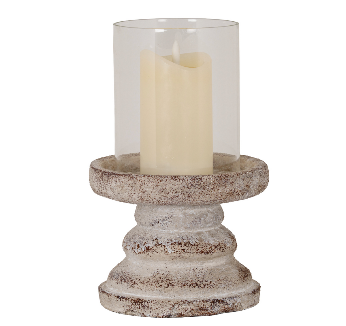 A rustic distressed stone-look candle holder with a tiered pedestal base and a clear glass cylinder on top, holding a cream-colored pillar candle, shown against a plain white background.