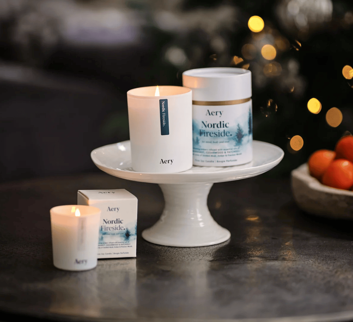 Aery candles and products on a table with a blurred background