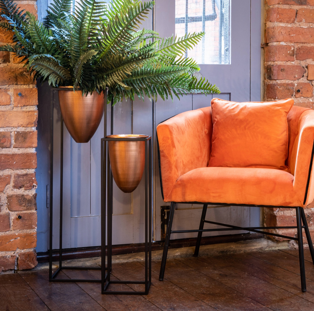 Raised Copper Planter With Black Metal Stand