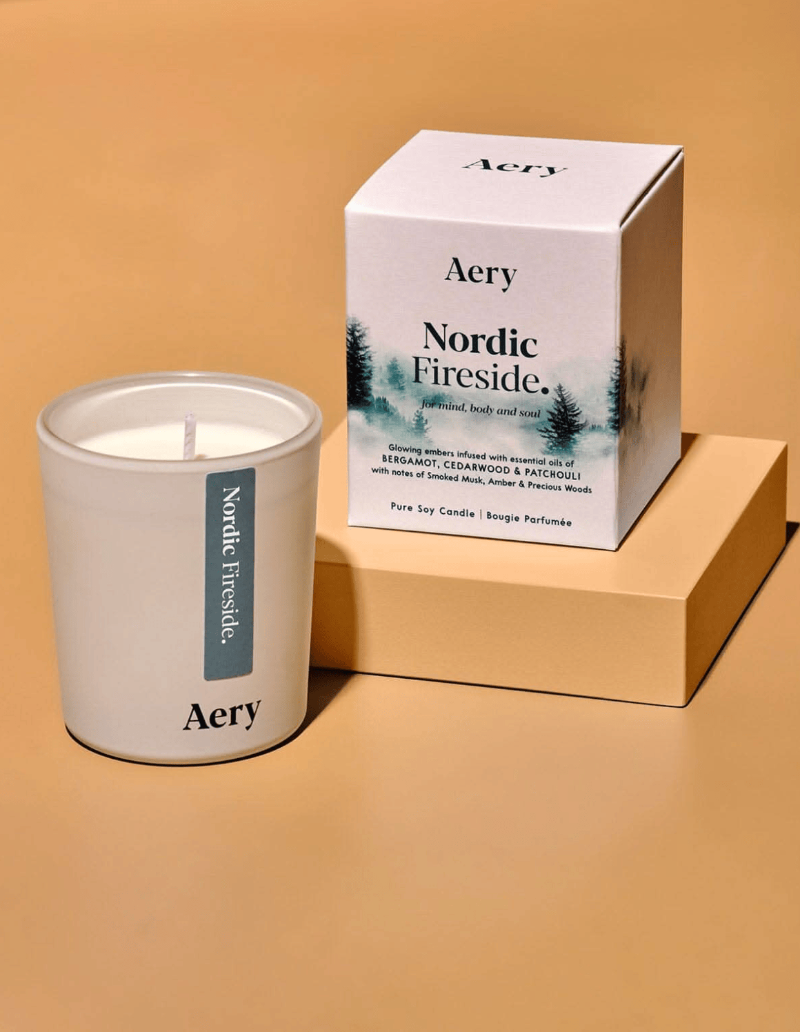 Aery Nordic Fireside candle and packaging on a beige background
