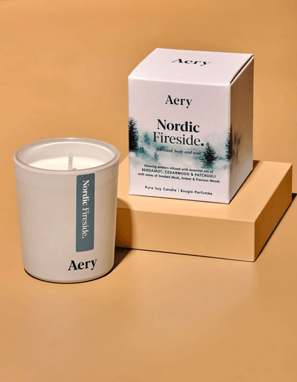 Aery Nordic Fireside candle and packaging on a beige background