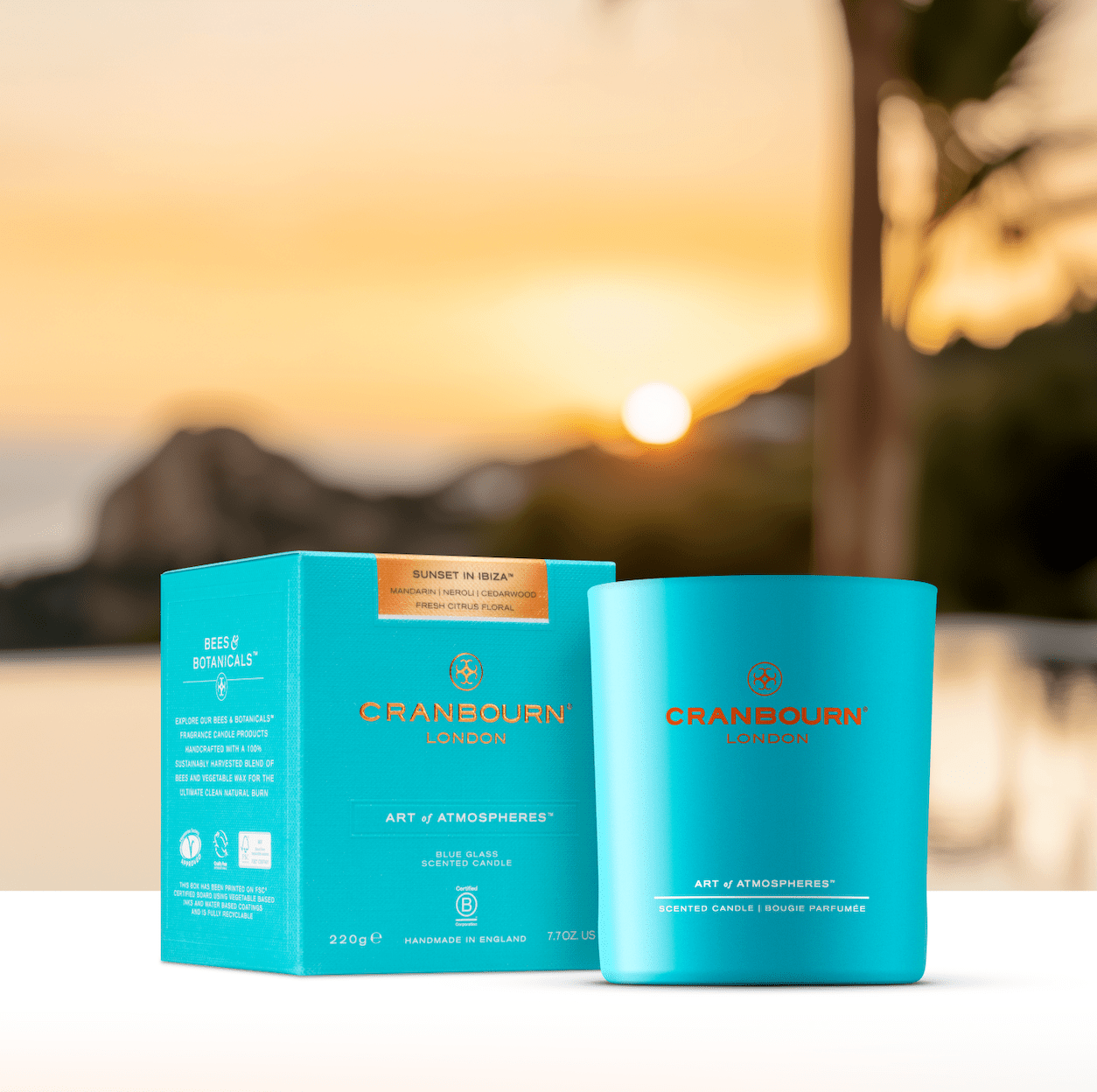 Blue glass Sunset in Ibiza candle with sunset background by Cranbourn London