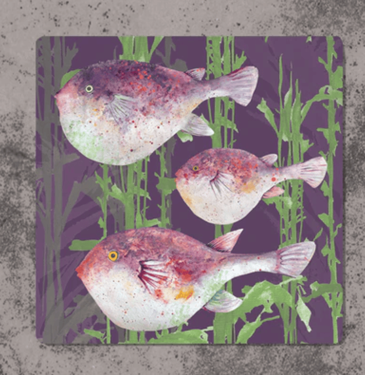Decorative mouse pad with fish design on a textured surface
