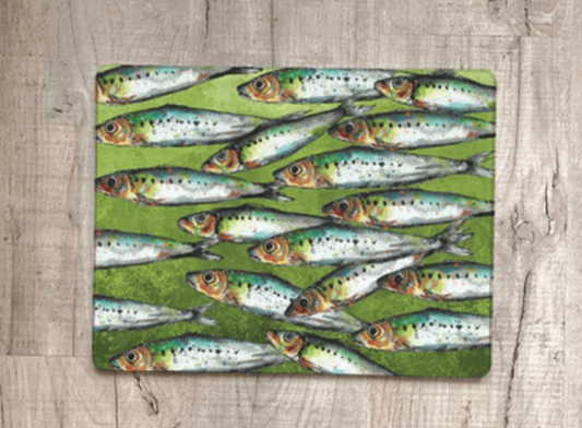 Placemat with fish pattern on a wooden surface