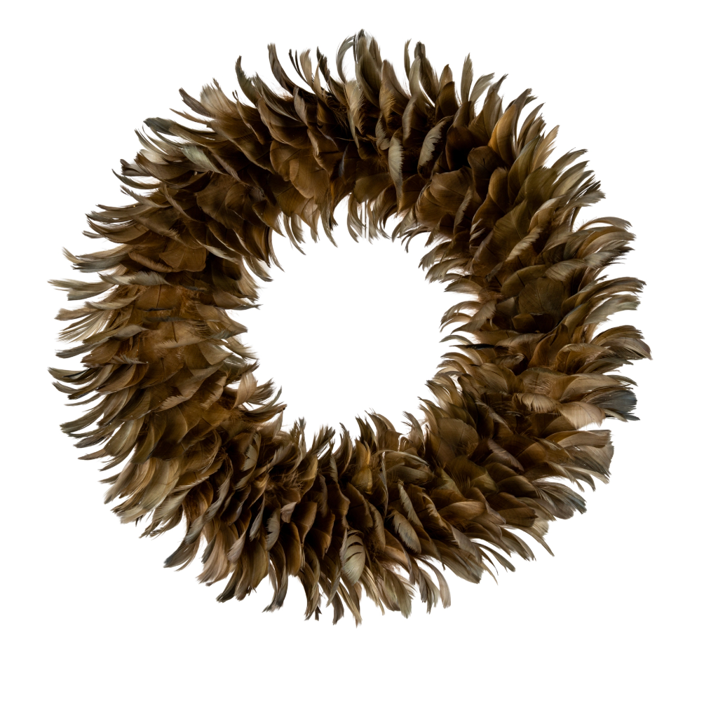 A circular decorative wreath made of layered brown feathers, photographed against a solid white background.