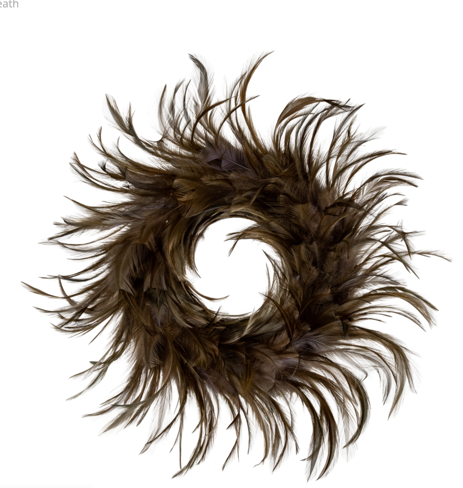 A circular feather wreath made of layered brown feathers with darker tips, arranged in a spiral pattern on a solid white background.