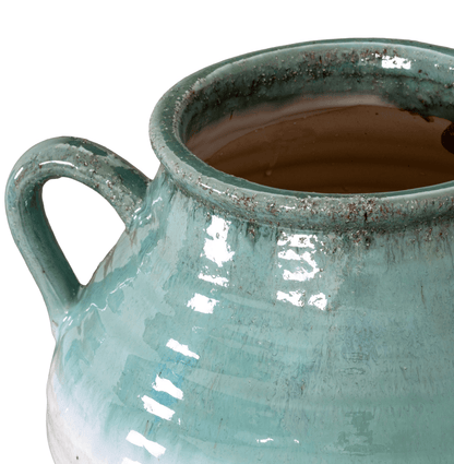 Close-up of a ceramic mug with a handle on a white background