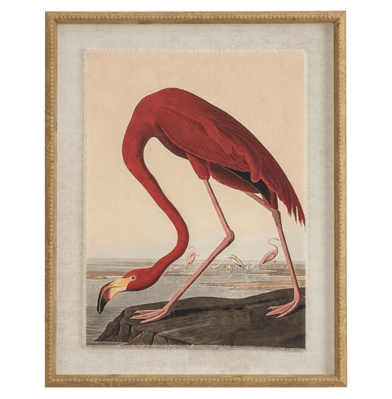 Framed artwork of a red flamingo on a rock with a beige background