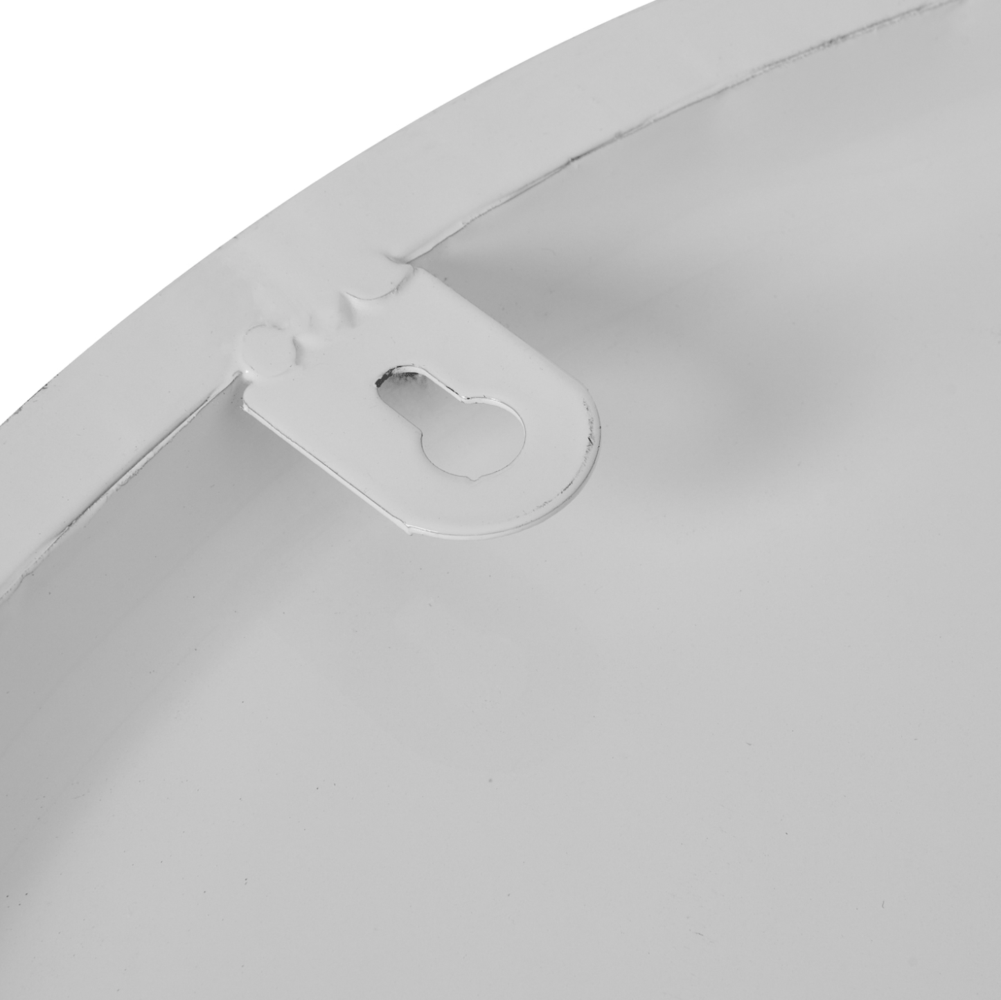 Close-up of a white plastic component on a white background