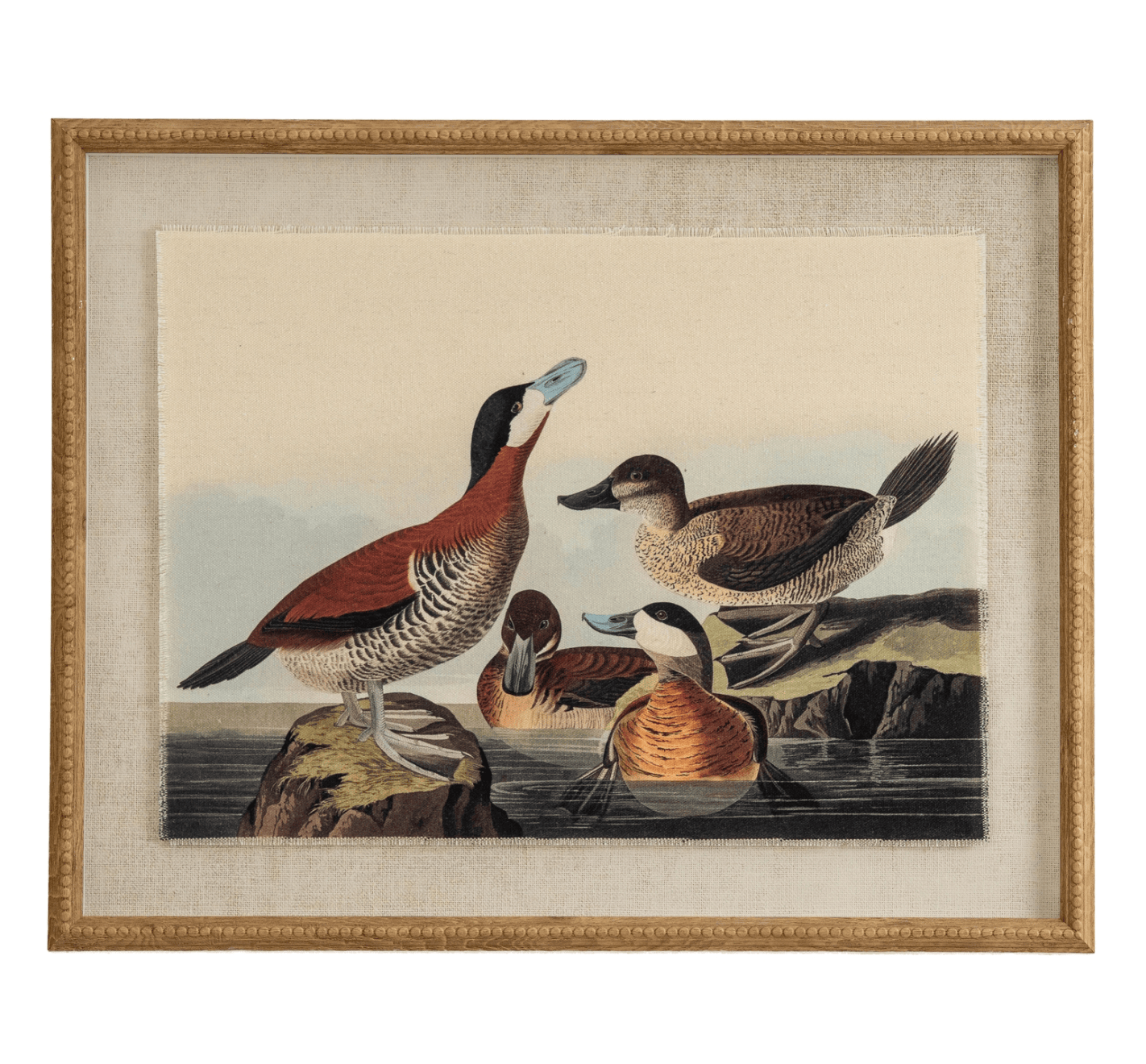 Framed artwork of four ducks on a rock with a natural landscape background.