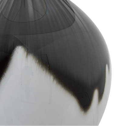 Close-up of a glossy black and white vase on a white background