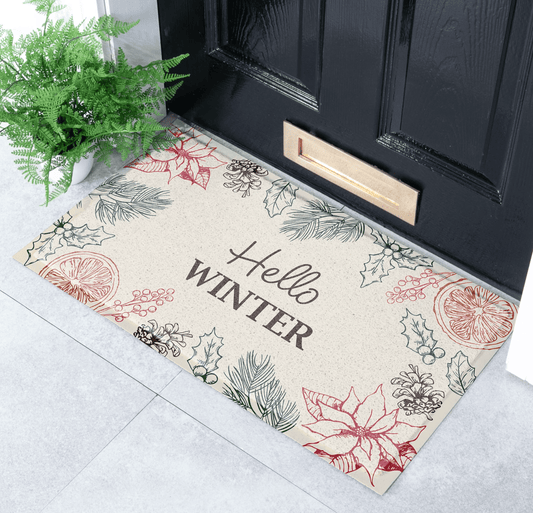 Decorative doormat with 'Hello Winter' text and winter-themed illustrations on a black door.
