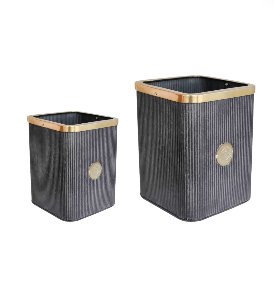 Two black rectangular trash cans with gold accents on a white background