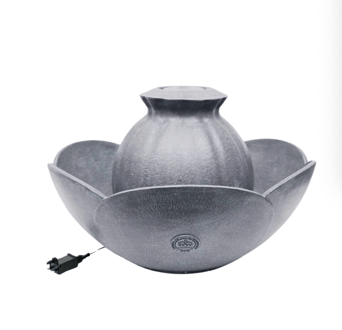 A gray textured ceramic lotus-shaped tabletop fountain with a central dome and a small black power cord on a white background.