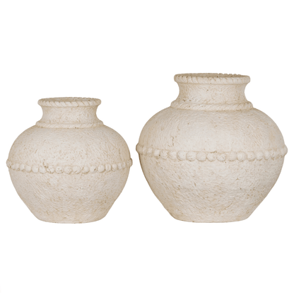Two white textured vases on a white background