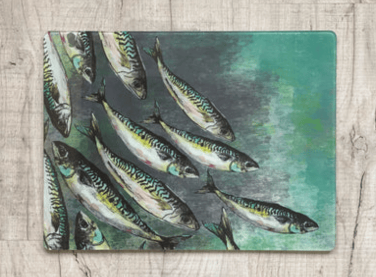 Placemat with fish design on a wooden surface