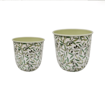 Two floral-patterned planters on a white background