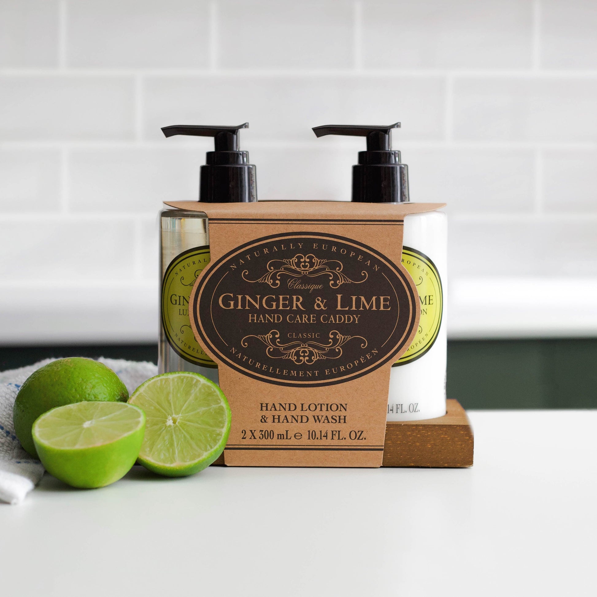 Somerset Toiletries Ginger and Lime hand care caddy with 2 x pump bottles and packaging on a white surface.