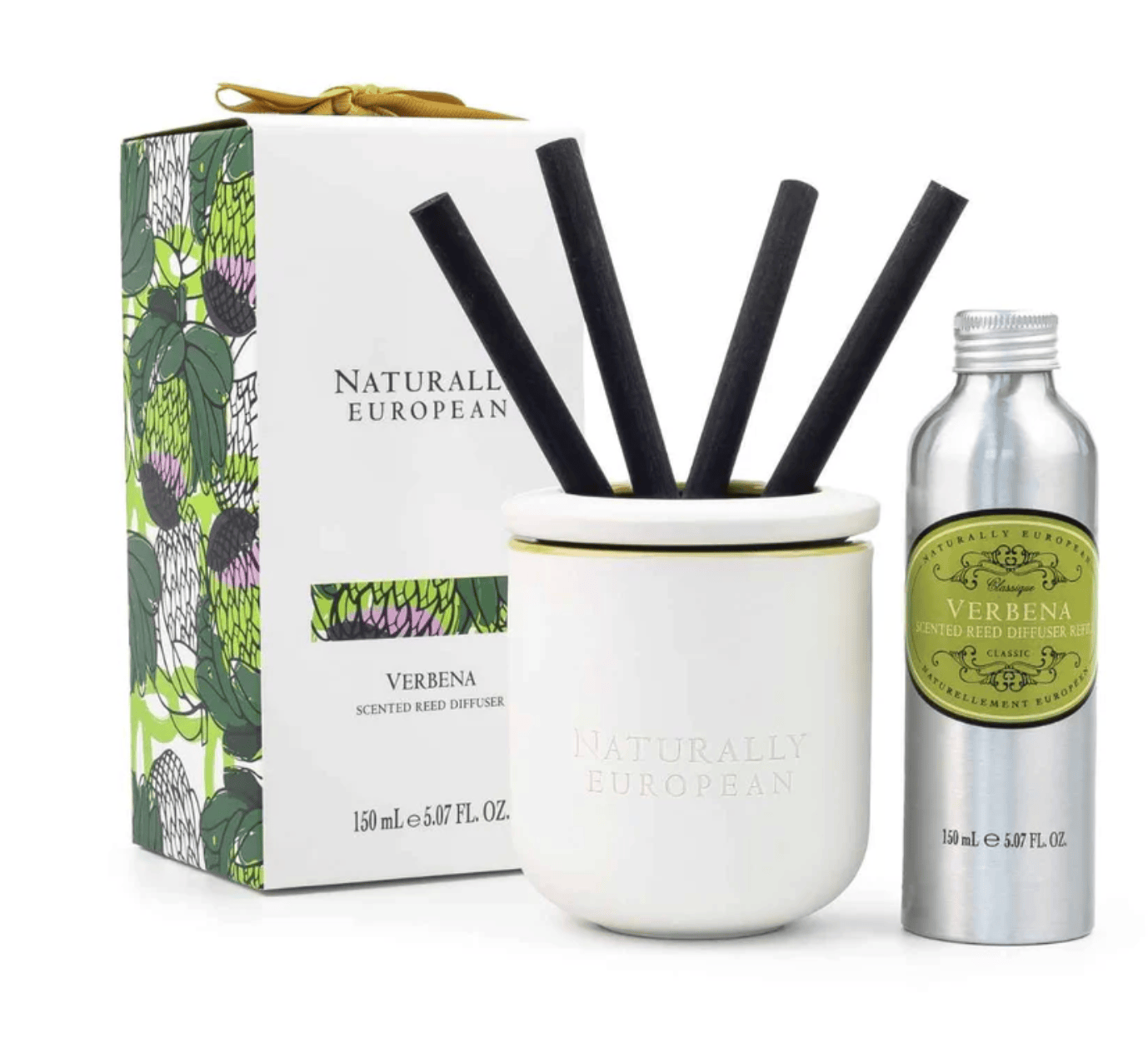 Naturally European Verbena scented reed diffuser set with a white ceramic diffuser bowl, four black reeds, a silver atomizer bottle, and its illustrated green and white box.