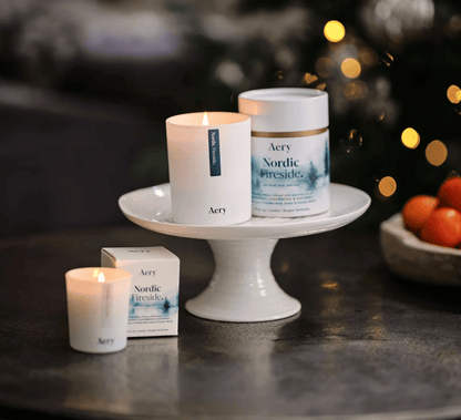 Aery candles and products on a table with a blurred background