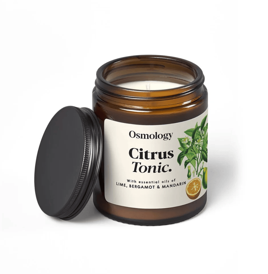 Osmology Citrus Tonic candle in a glass jar with a black lid on a white background