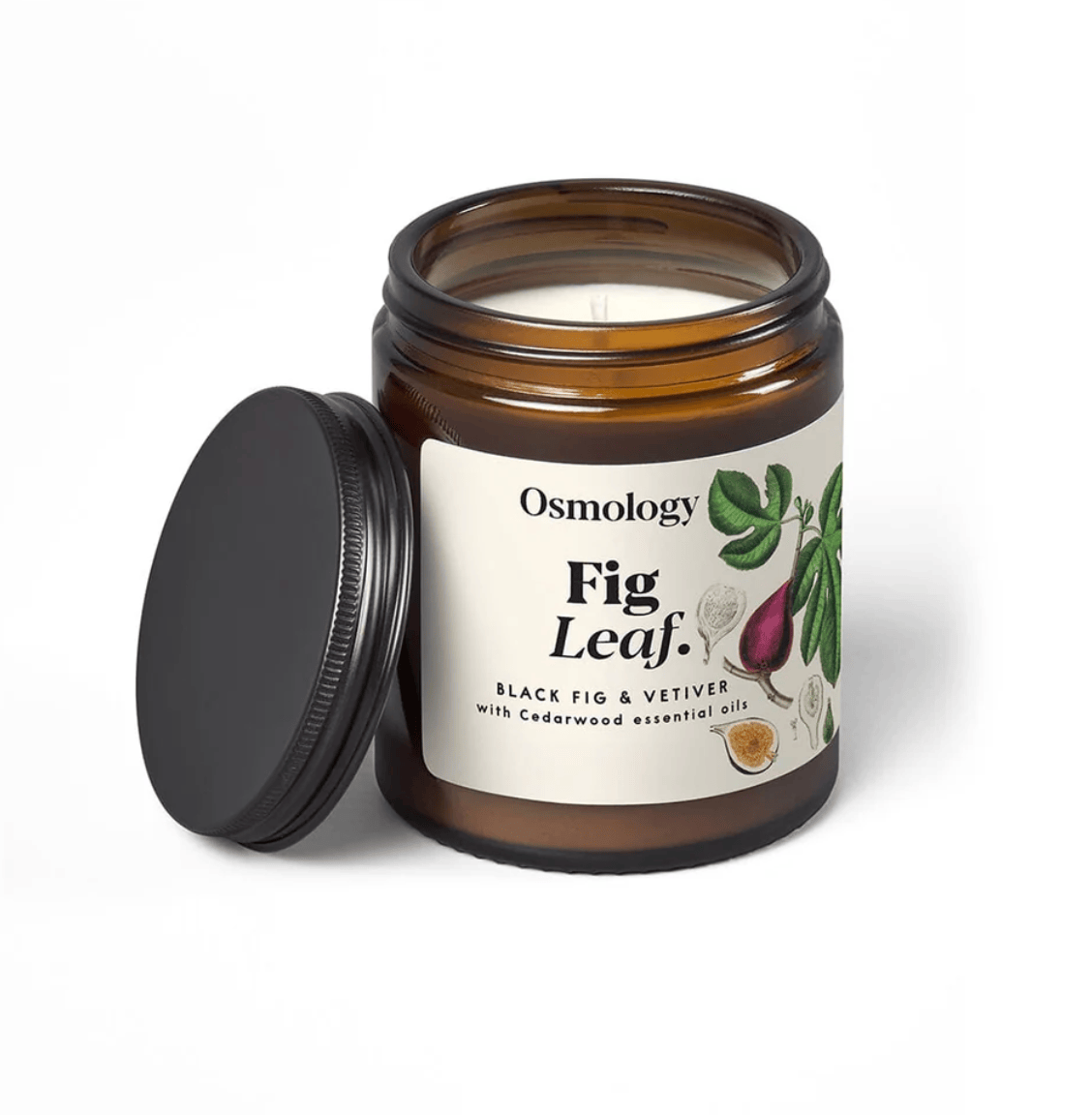 Osmology Fig Leaf candle in a brown jar with a black lid on a white background