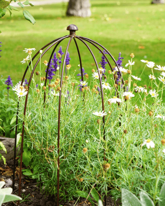 Decorative Plant Support with flowers and plants in a garden setting