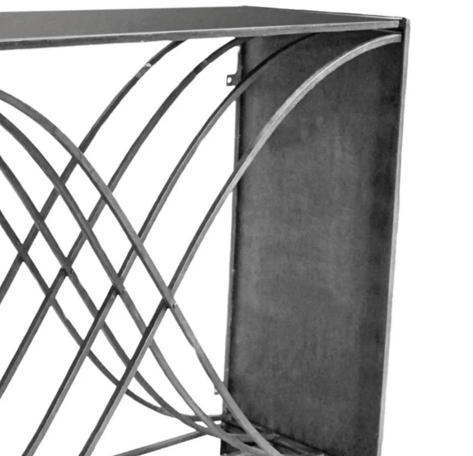 Close-up of a geometric metal design with interlocking shapes on a white background