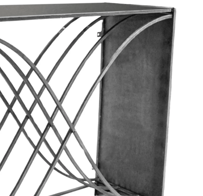 Close-up of a geometric metal design with interlocking shapes on a white background