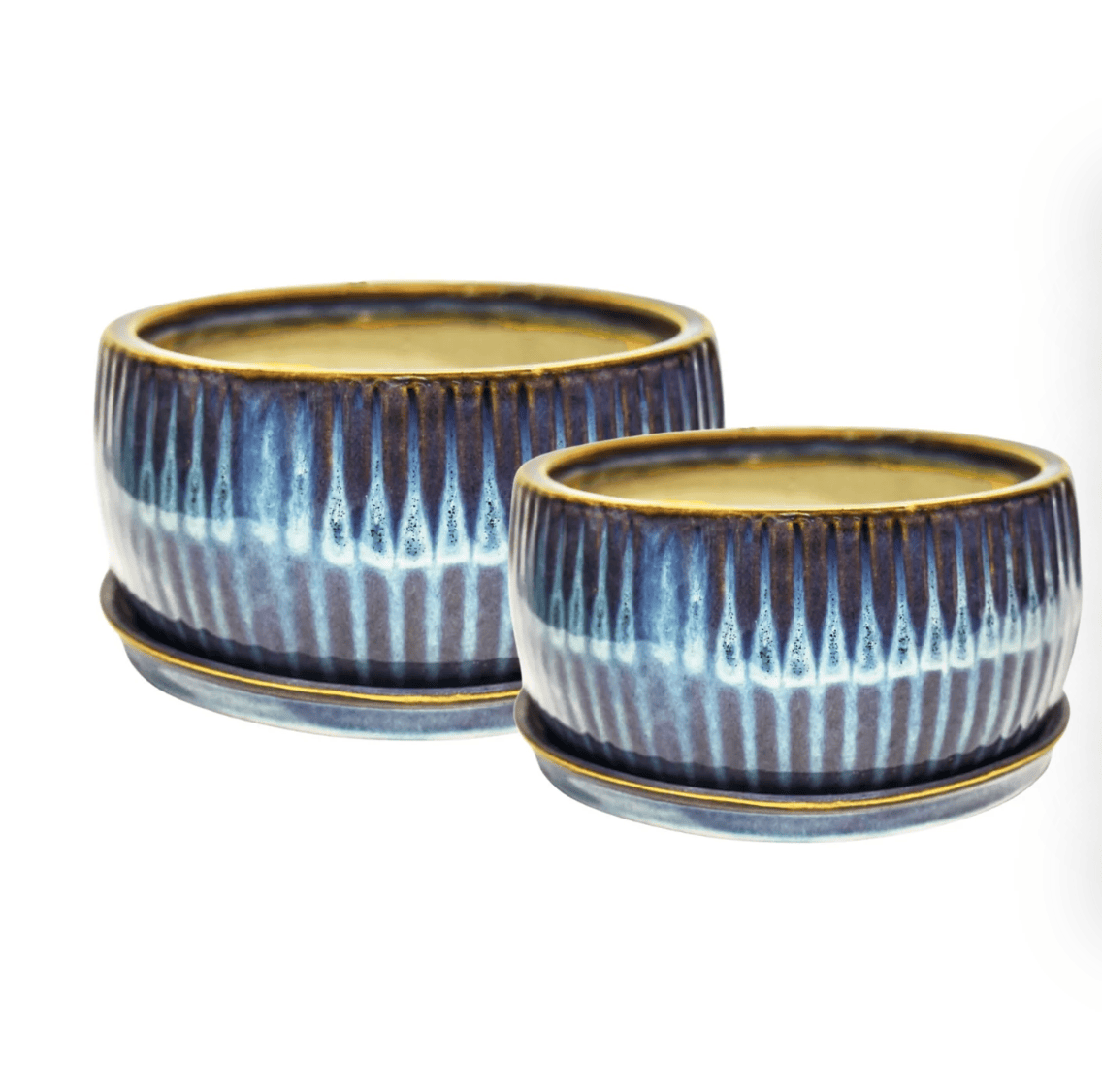 Two ceramic pots with blue and white striped design on a white background