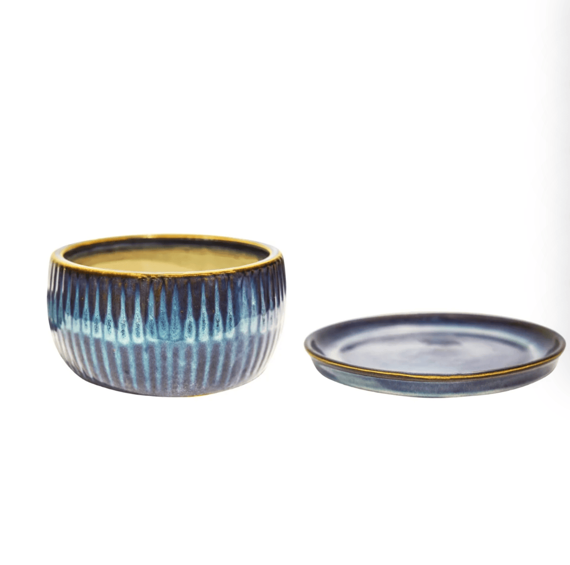 Set of two ceramic bowls with blue and gold patterns on a white background