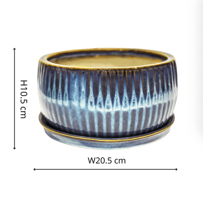 Ceramic planter with blue and white pattern and dimensions on a white background