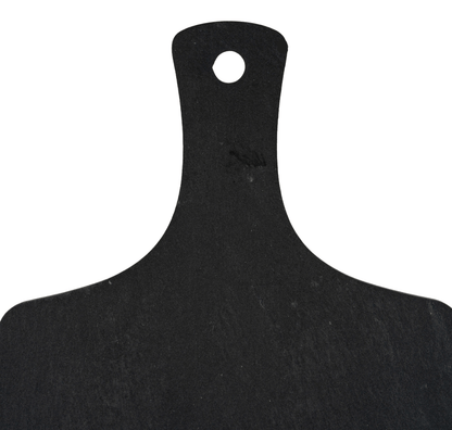 Black cutting board with a handle on a white background