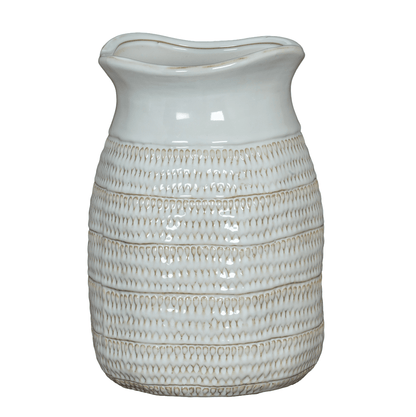 White ceramic vase with textured design on a white background