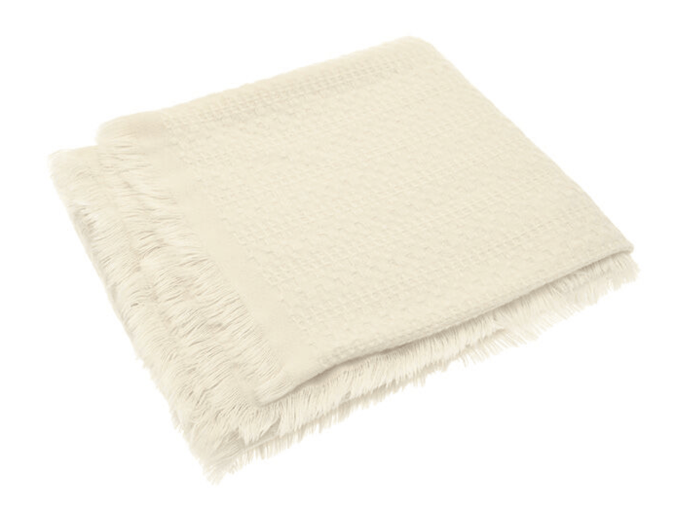 Beige fluffy blanket on a white background