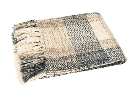 Plaid blanket with fringe on a white background