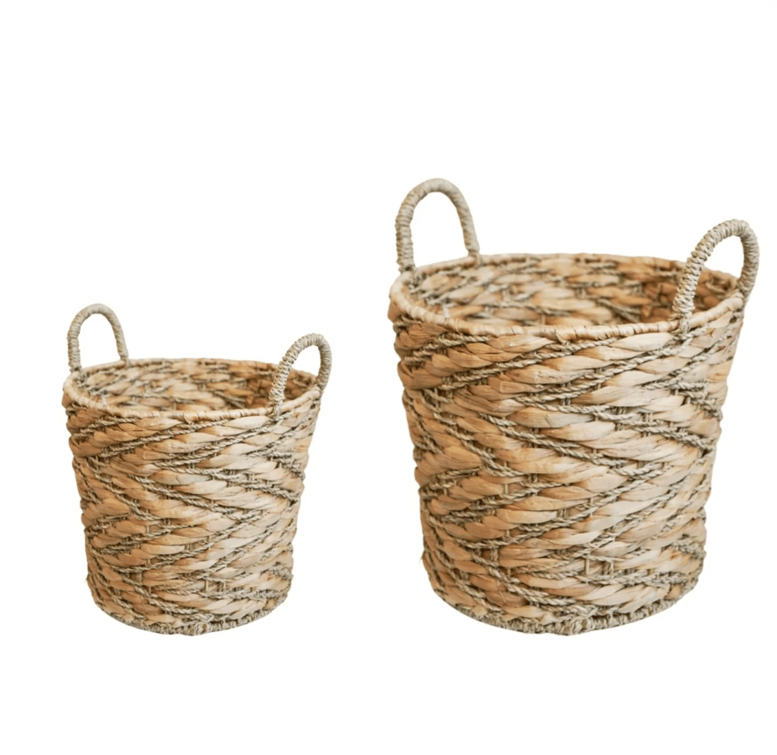 Two woven baskets with handles on a white background