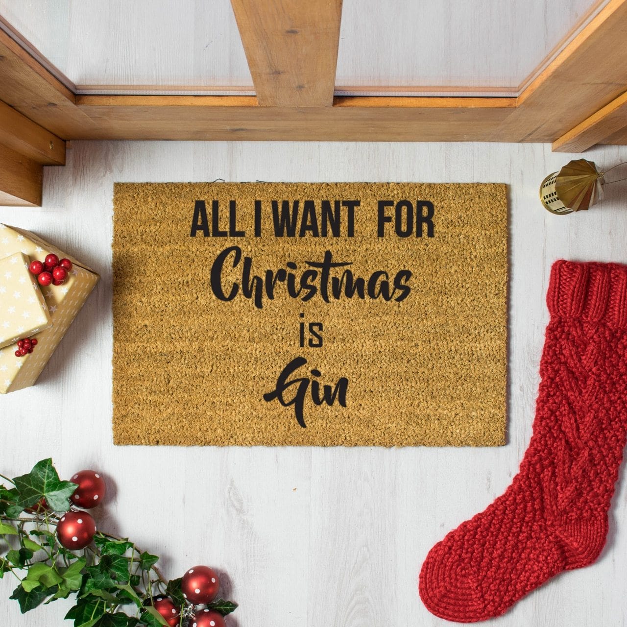 Welcome doormat with 'All I Want For Christmas Is Gin' slogan  