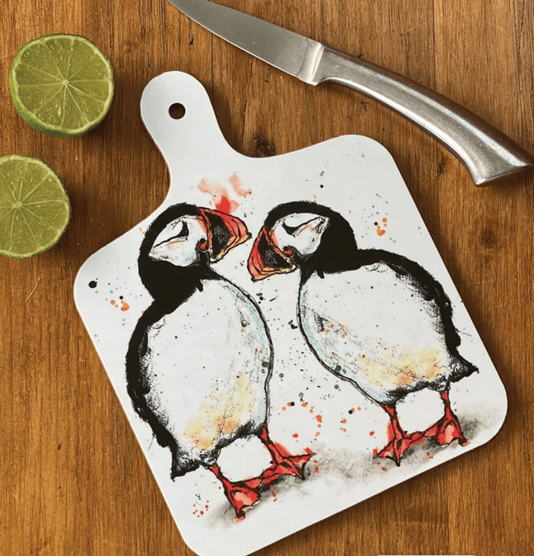 Small chopping board with colourful Puffins design by Dollyhotdogs