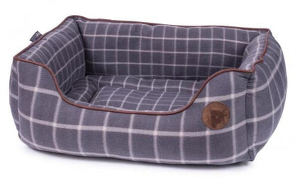 Dog bed with grey square check pattern and fleece base with brown piping detail medium size.
