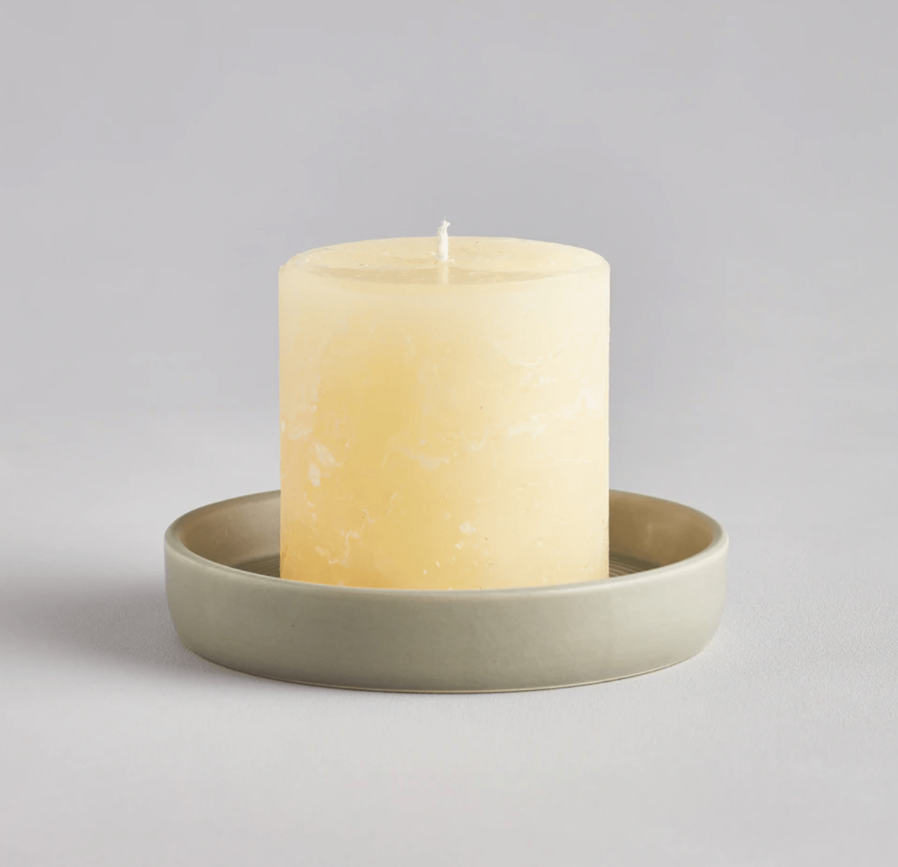 St. Eval Light Grey-Green Candle Plate 13cm x 2.5cm with small pillar candle