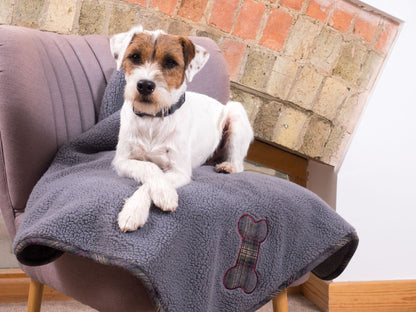 Dog enjoying the Petface Fleece Blanket With Grey Tweed Detail