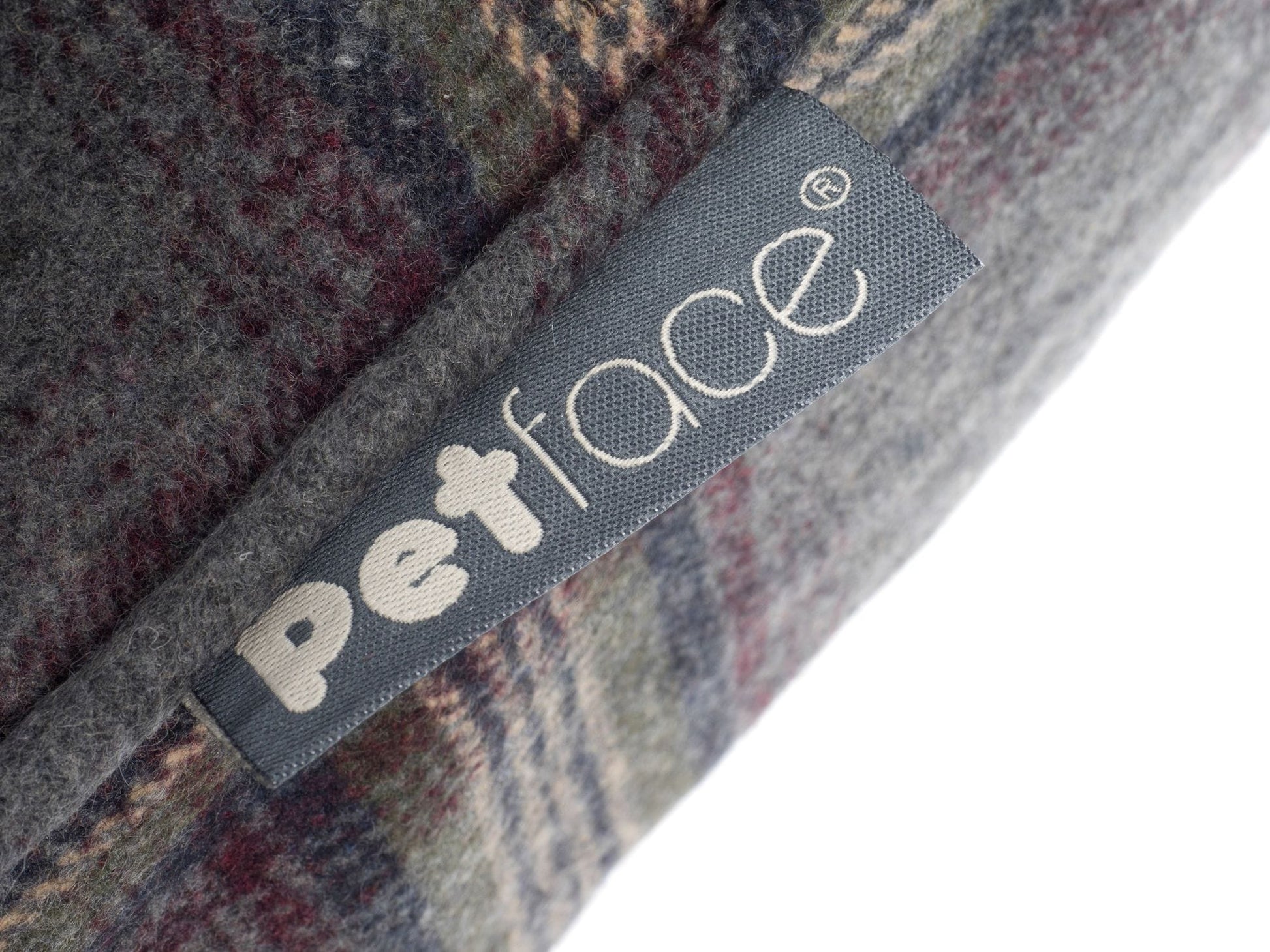 Petface tab on seam of pillow mattress dog bed, medium size in a grey tweed pattern.